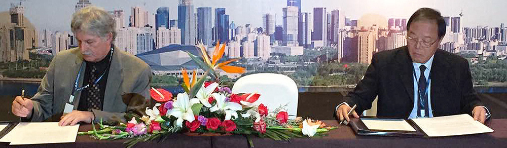 Ed Mazria, Architecture 2030, and Chen Zhen, Secretary-General of the CEDAAB, sign the China Accord